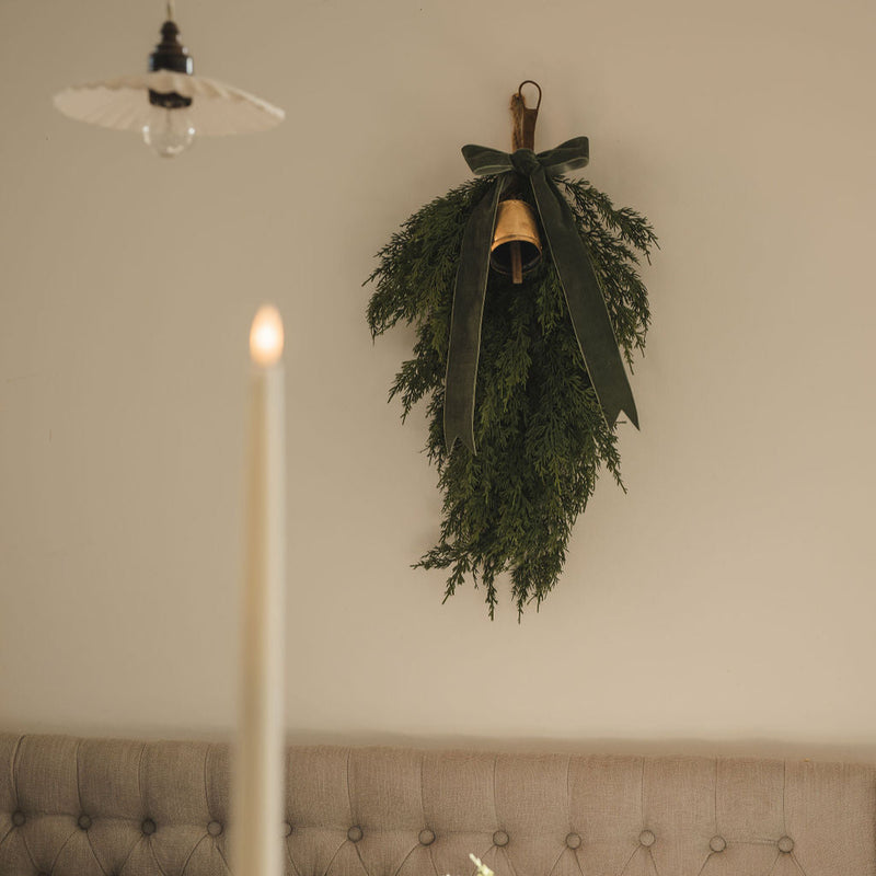 Real touch cedar cypress swag styled across a fireplace mantel