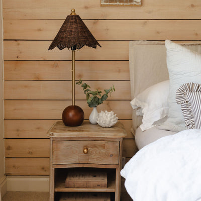 Arlo handwoven table lamp on a bedside table