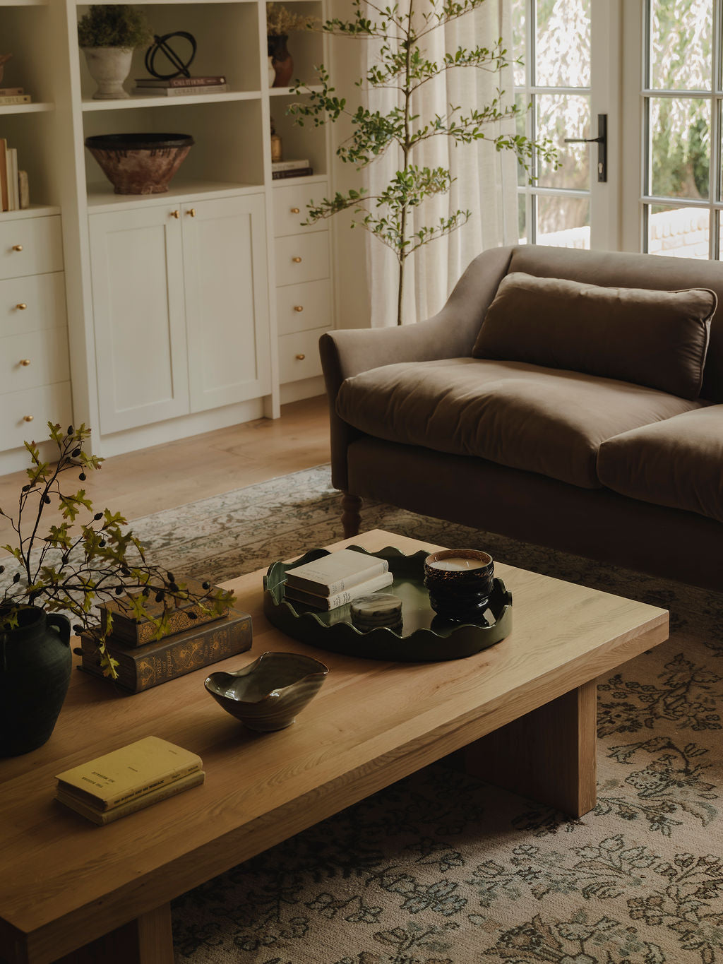 Green mango wood tray styled on coffee table