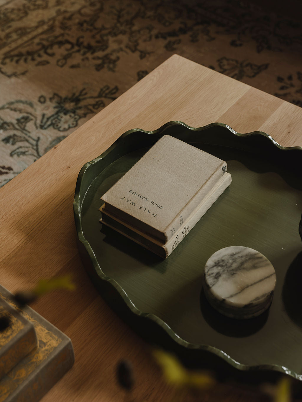 Close-up of glossy green finish and wood grain on tray